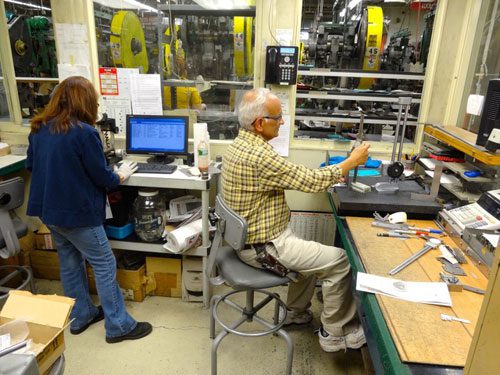 Man & Women Working In Industrial Engineering Works